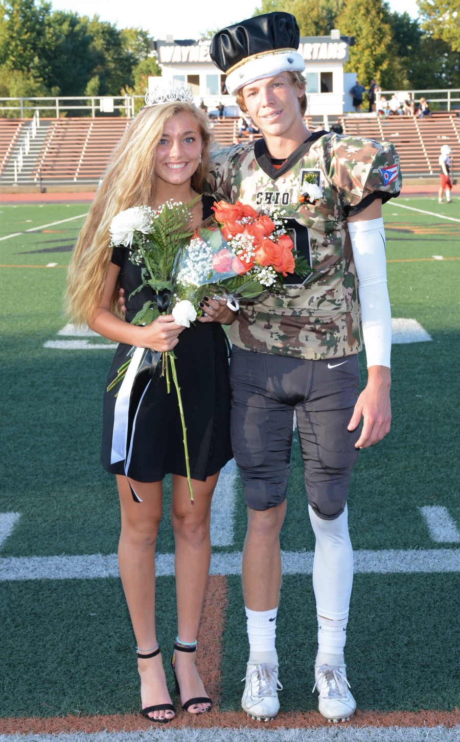 boy and girl crowned with flowers